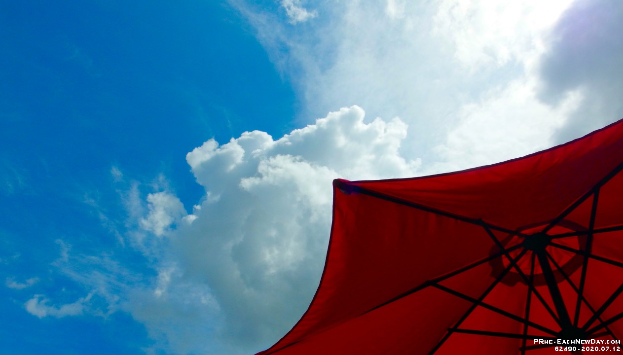 62490CrLe - Clouds above our patio umbrella
